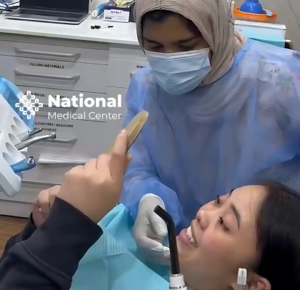 Before and after smile transformation showing orthodontic alignment at National Medical Center
